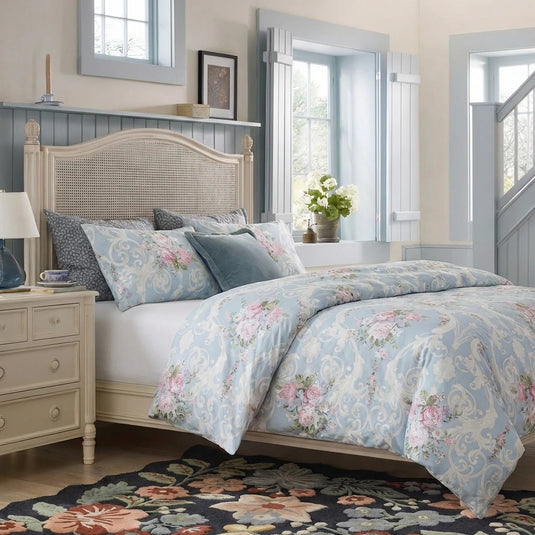ornate floral bedding in bright bedroom
