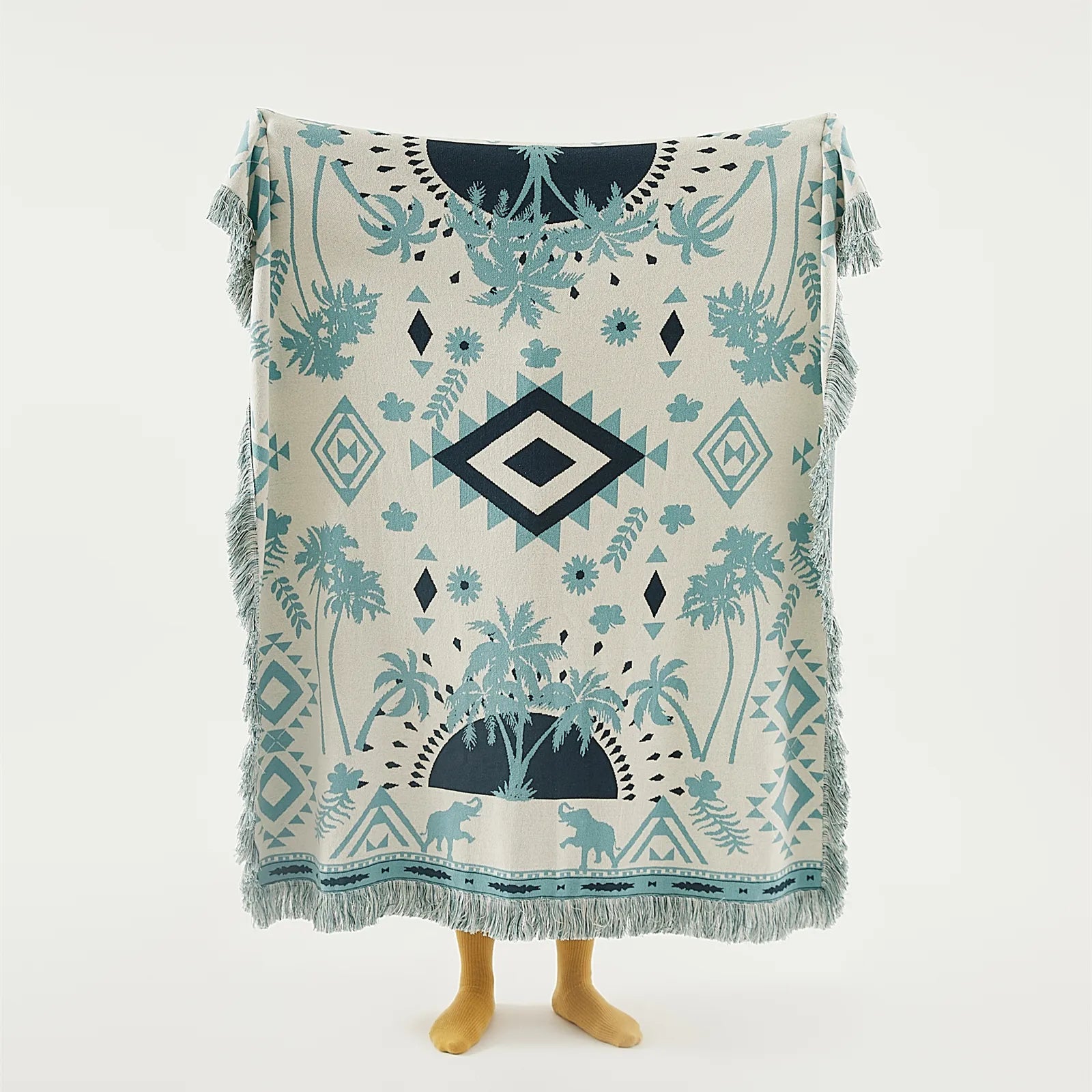 full view of the bohemian-style Prussian blue cotton blanket, spread out to show its complete design.