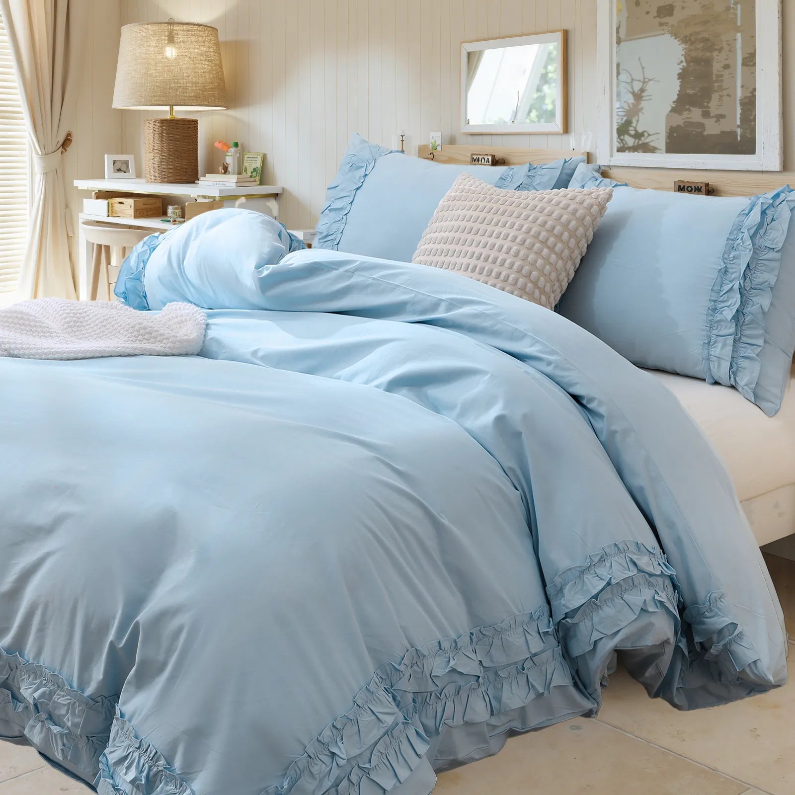 A close-up of the blue ruffled comforter set showing fabric texture