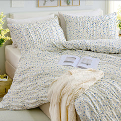 Blue floral cotton duvet set headboard close