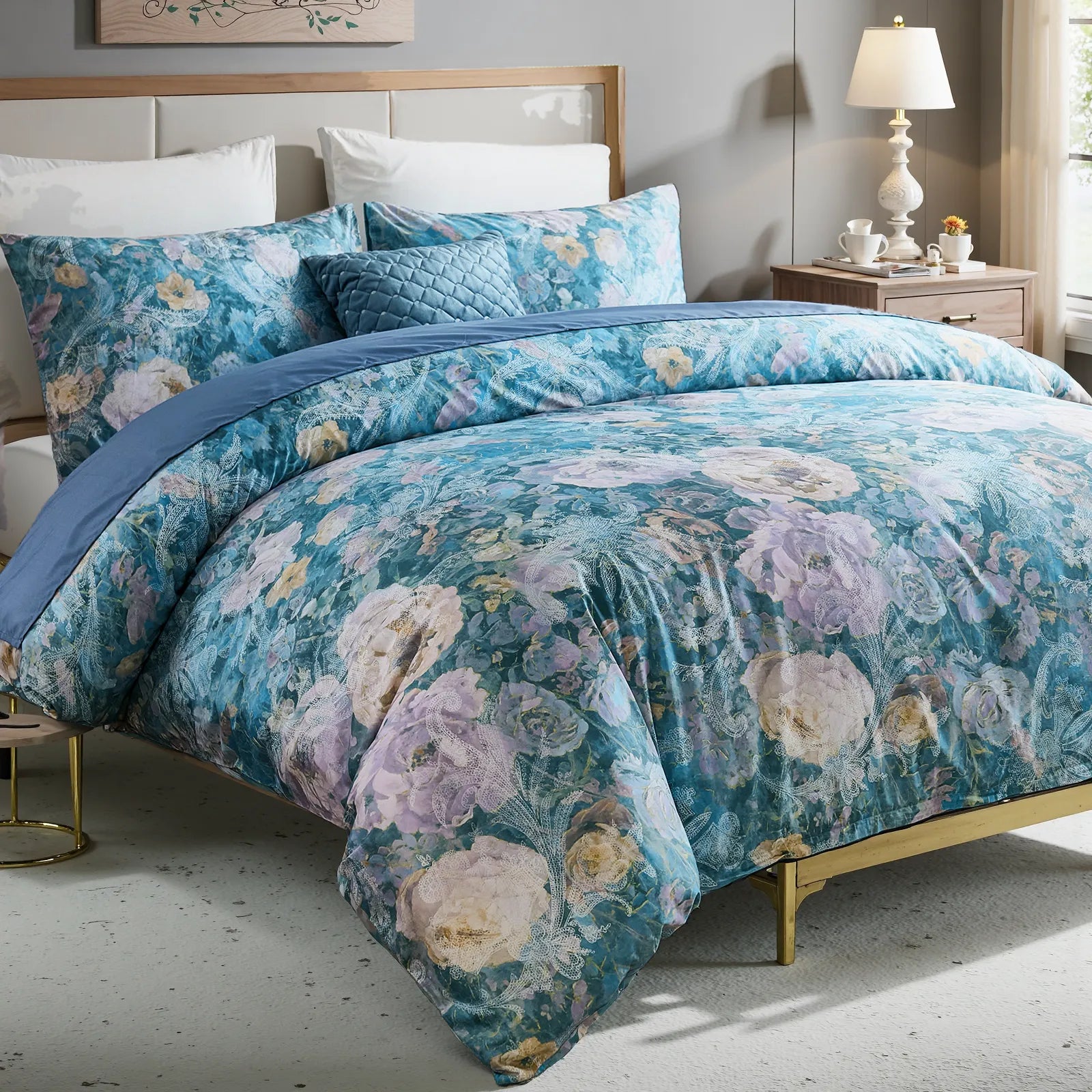 Blue floral duvet cover set with lace pattern fully displayed on bed