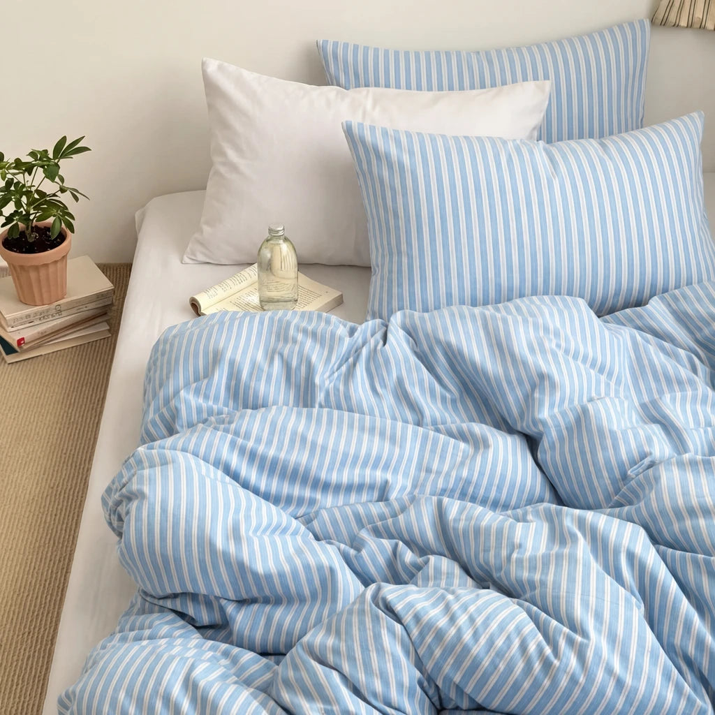 blue white striped bedding with white pillowcases
