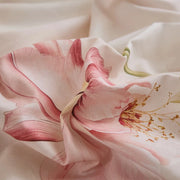 close-up of blush lily blossom botanical print on soft breathable cotton fabric texture