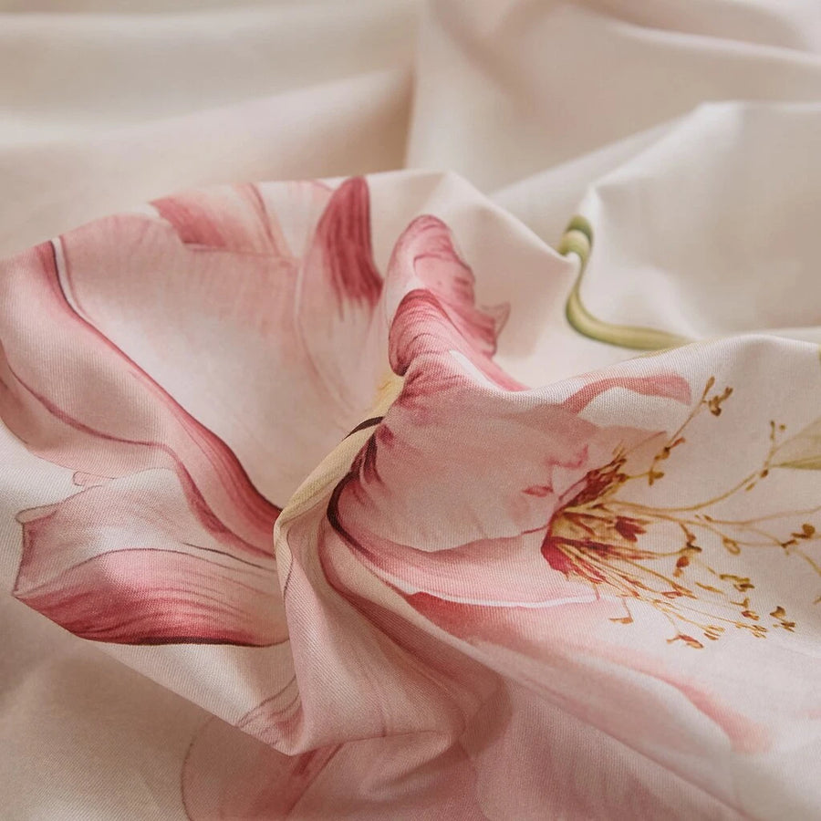 close-up of blush lily blossom botanical print on soft breathable cotton fabric texture