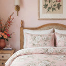 close-up of romantic peony print cotton pillowcases against a vintage wooden headboard
