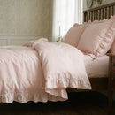 blush pink ruffle duvet cover side view sunlight