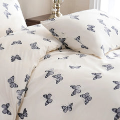 A close-up of the delicate butterfly pattern on the cotton duvet cover