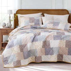 An inviting angled view of the 100% cotton floral quilt set.
