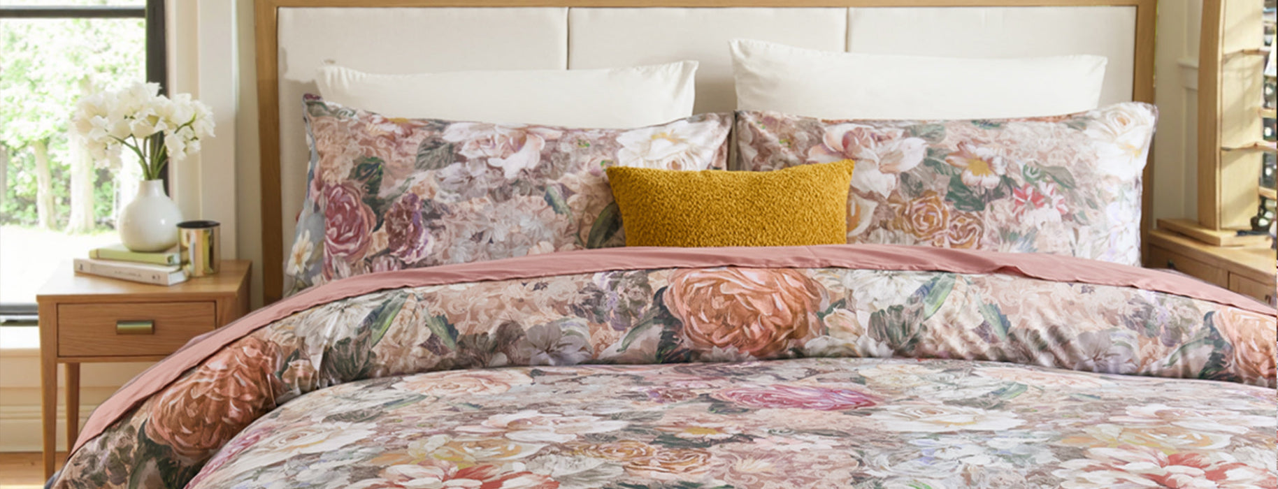 Cotton floral print bedding set with watercolor vintage flower design and yellow accent pillow.