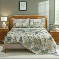 Full view of cotton patchwork floral sheet set on bed with rattan headboard	
