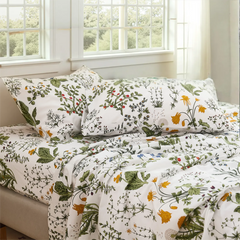 Daylight close-up of cotton sateen pillows showing Lush Botanical print detail