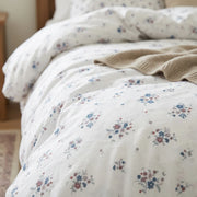 country breeze ditsy floral fabric texture close up detailed print