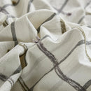cream windowpane tufted cotton fabric texture close up
