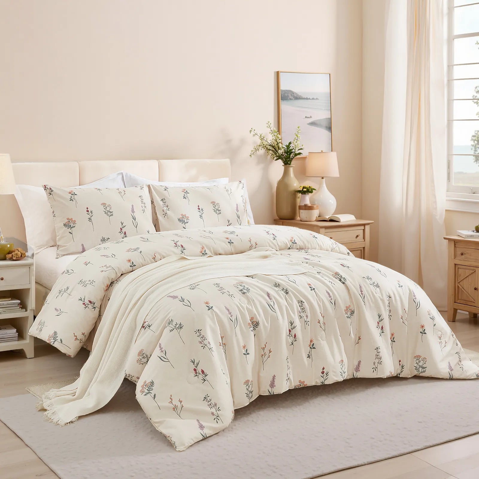 A bed with a floral comforter set, a beige knit blanket, and a light wood nightstand in a bright, inviting bedroom