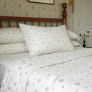 dainty wildflower meadow cotton sheets wooden nightstand