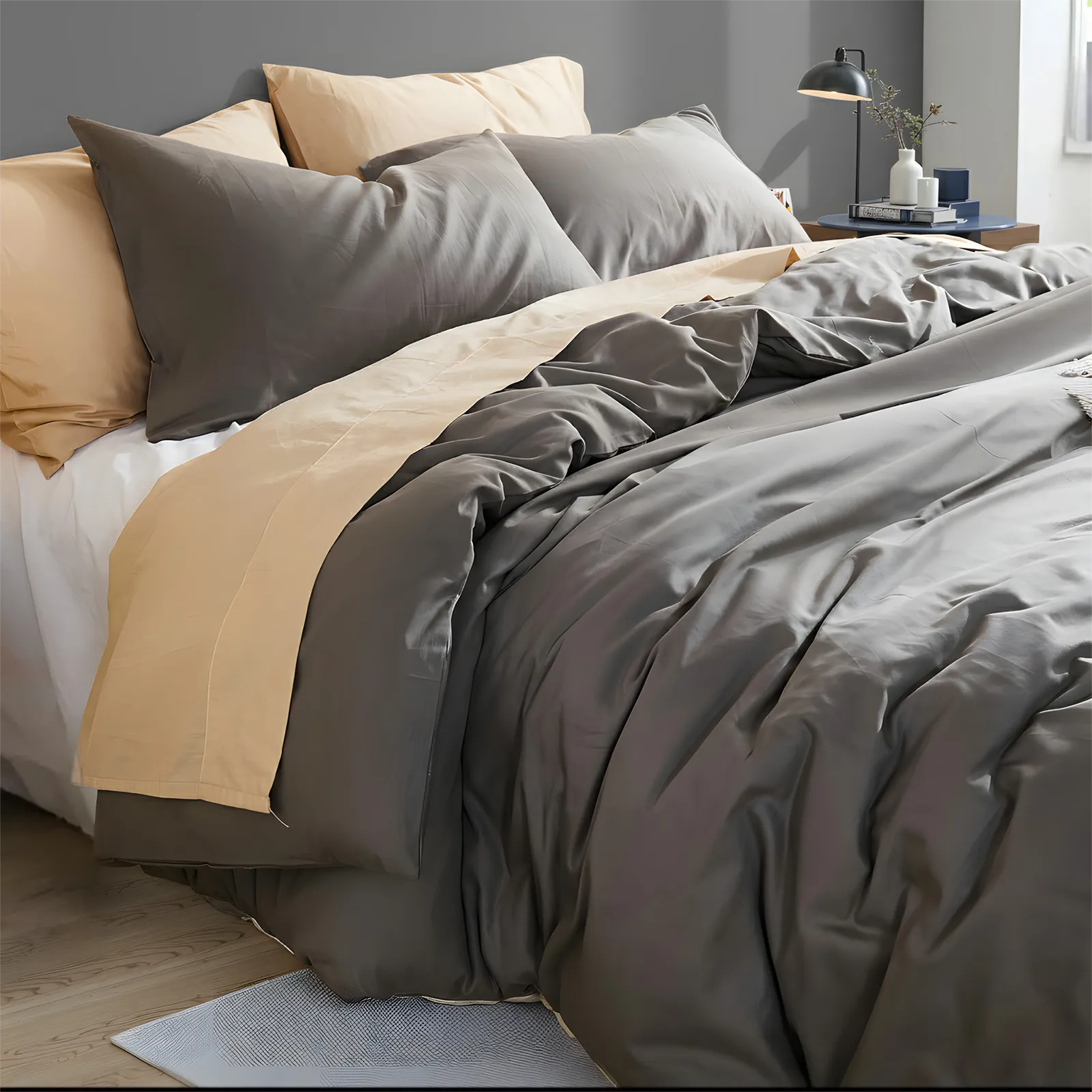 Angled view of dark gray duvet showing natural folds and texture