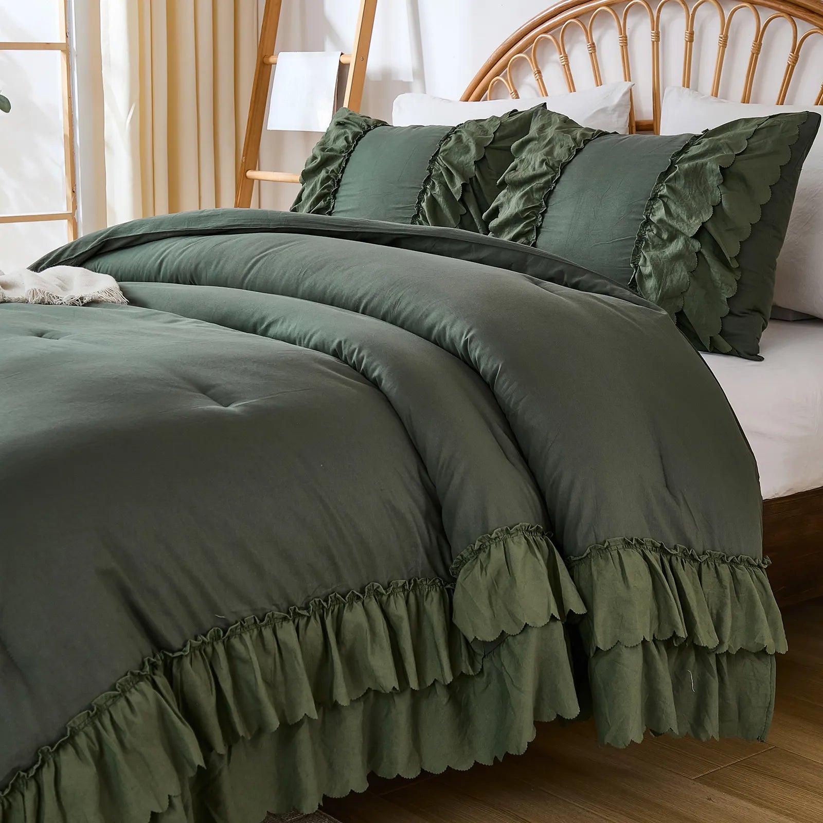 Side angle of deep green double ruffle comforter with pillows
