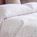 dreamy pastel comforter set pink blue floral fabric texture close up