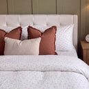 dreamy pastel comforter set pink blue floral terracotta fringe pillows headboard