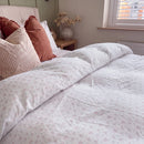 dreamy pastel comforter set pink blue floral terracotta pillows nightstand