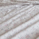dreamy pastel sheet set ditsy floral fabric closeup