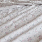 dreamy pastel sheet set ditsy floral fabric closeup