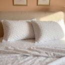 dreamy pastel sheet set warm toned bedroom scene