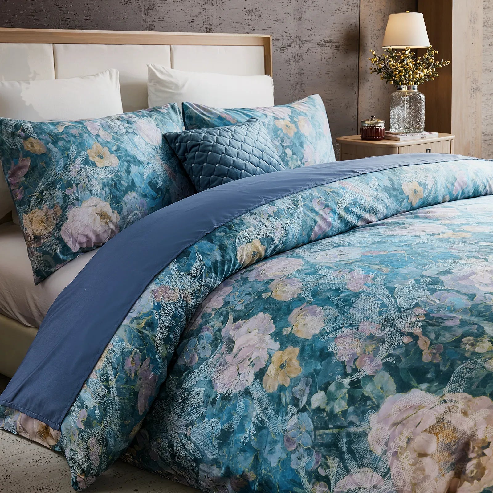 Detailed floral pattern on blue cotton duvet cover