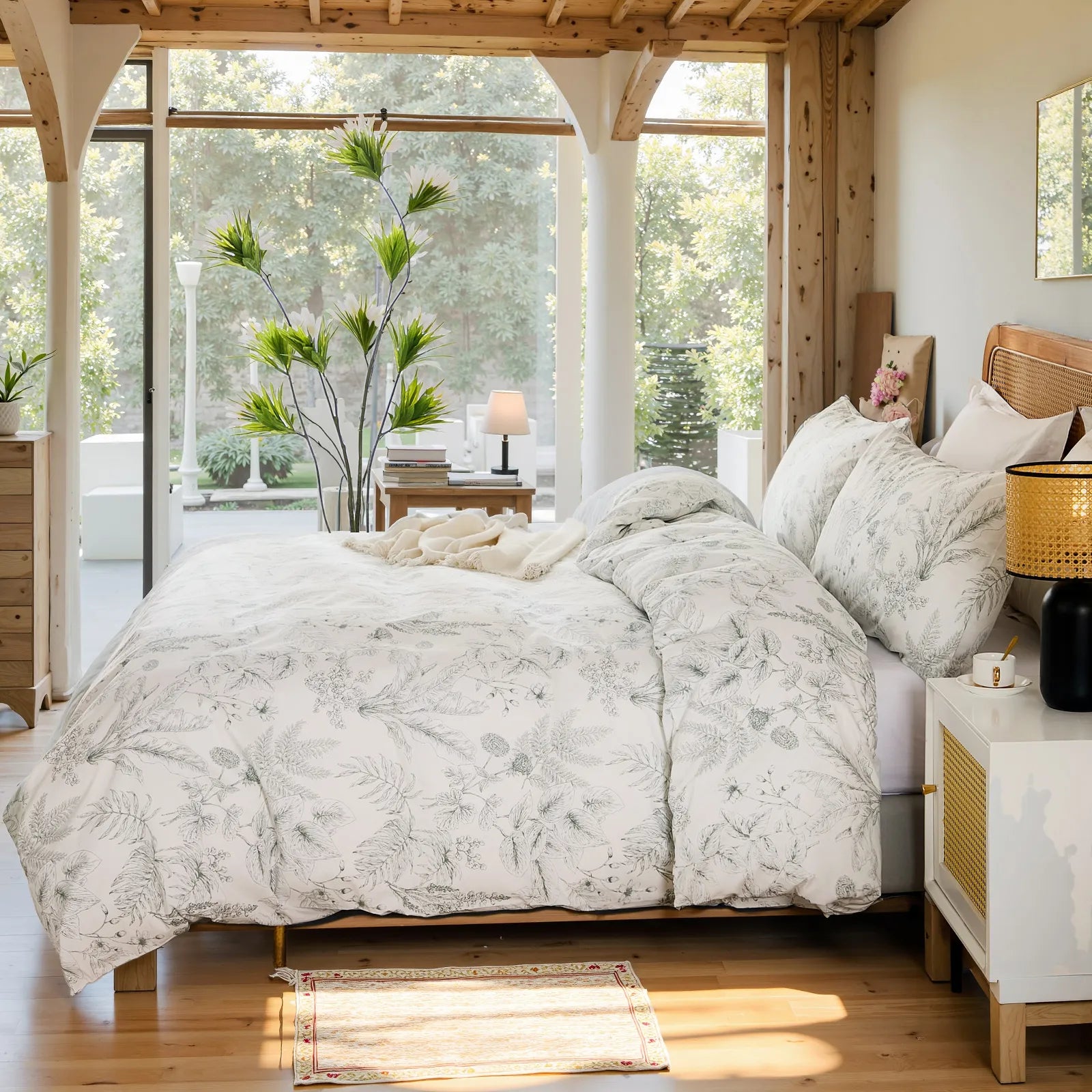 Side view of the elegant sketch floral duvet cover set on a bed.