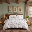 cottagecore aesthetic enchanted garden butterfly print bedding in natural sunlight