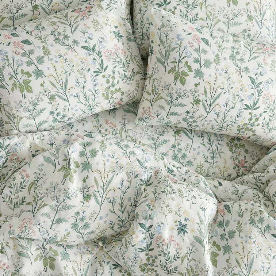 enchanted meadow wildflower bedding flat lay aesthetic