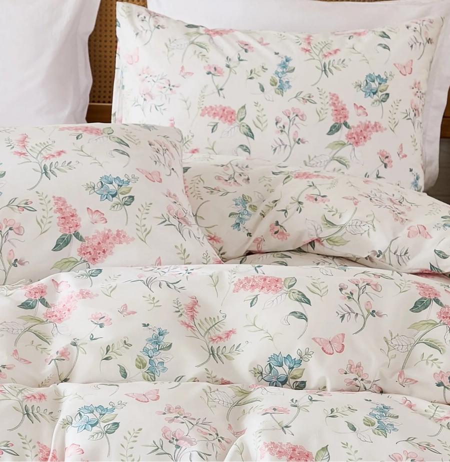 close-up of 100 percent premium cotton fabric with fine scattered floral and leaf print