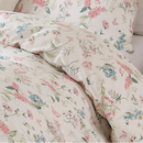 side view of white cotton quilt cover with fine botanical sprigs in a modern farmhouse interior