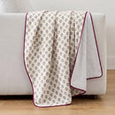 fernwood muslin blanket wildflower purple plum edge striped back light grey sofa
