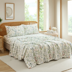 Wide shot of floral cotton sheet set in a bright, airy bedroom setting