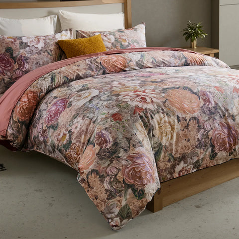 Neatly folded vintage floral cotton duvet cover and pillowcases