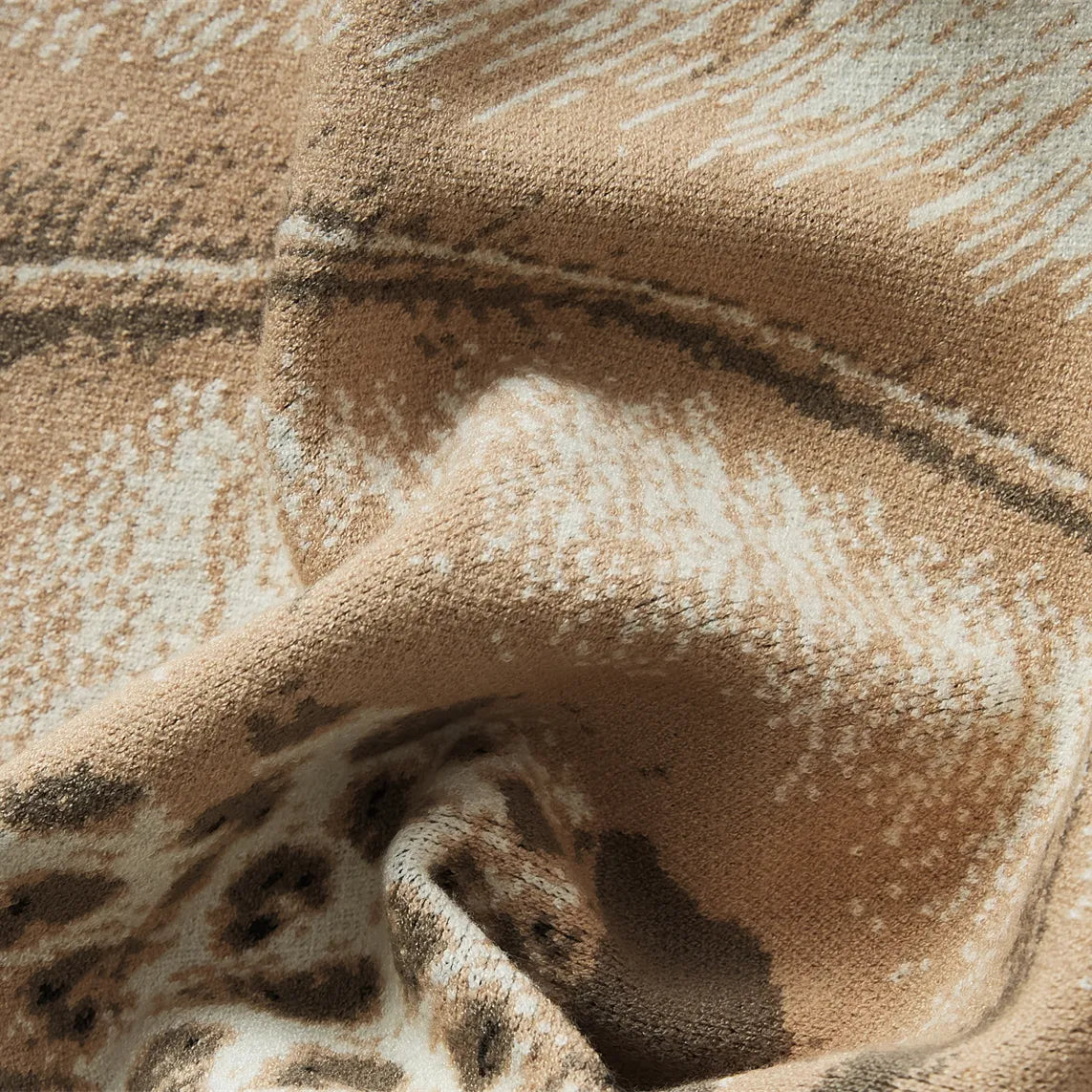 A close-up shot of the forest landscape blanket, showing its soft, plush texture and intricate woven design.