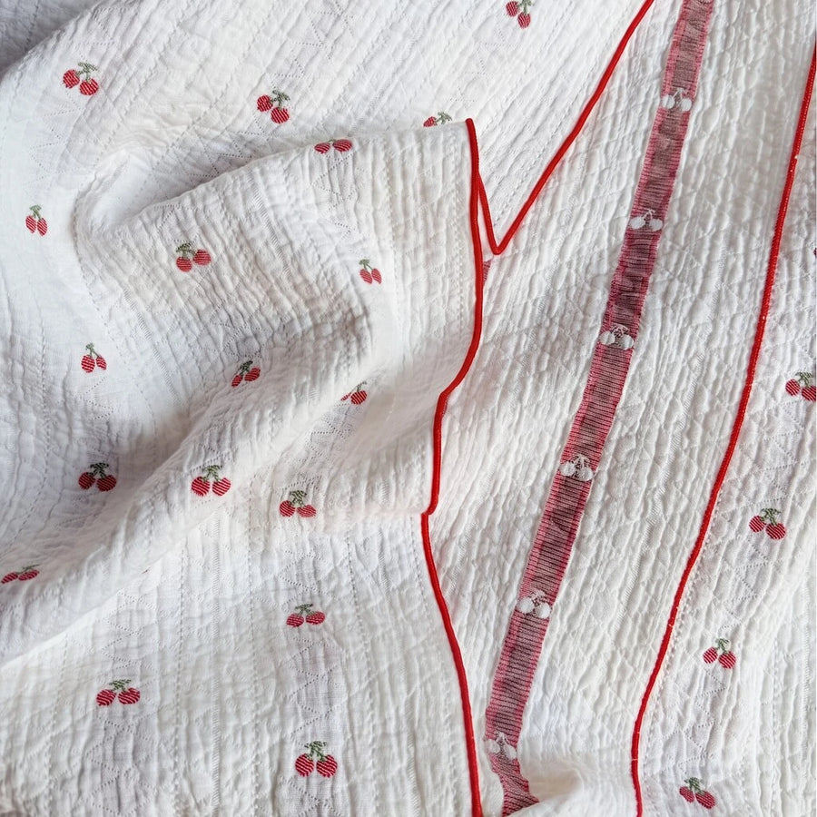 garden patch jacquard throw blanket cherry bud folded stripe detail