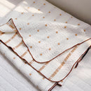 garden patch jacquard throw blanket maple khaki folded brown edge stripe detail