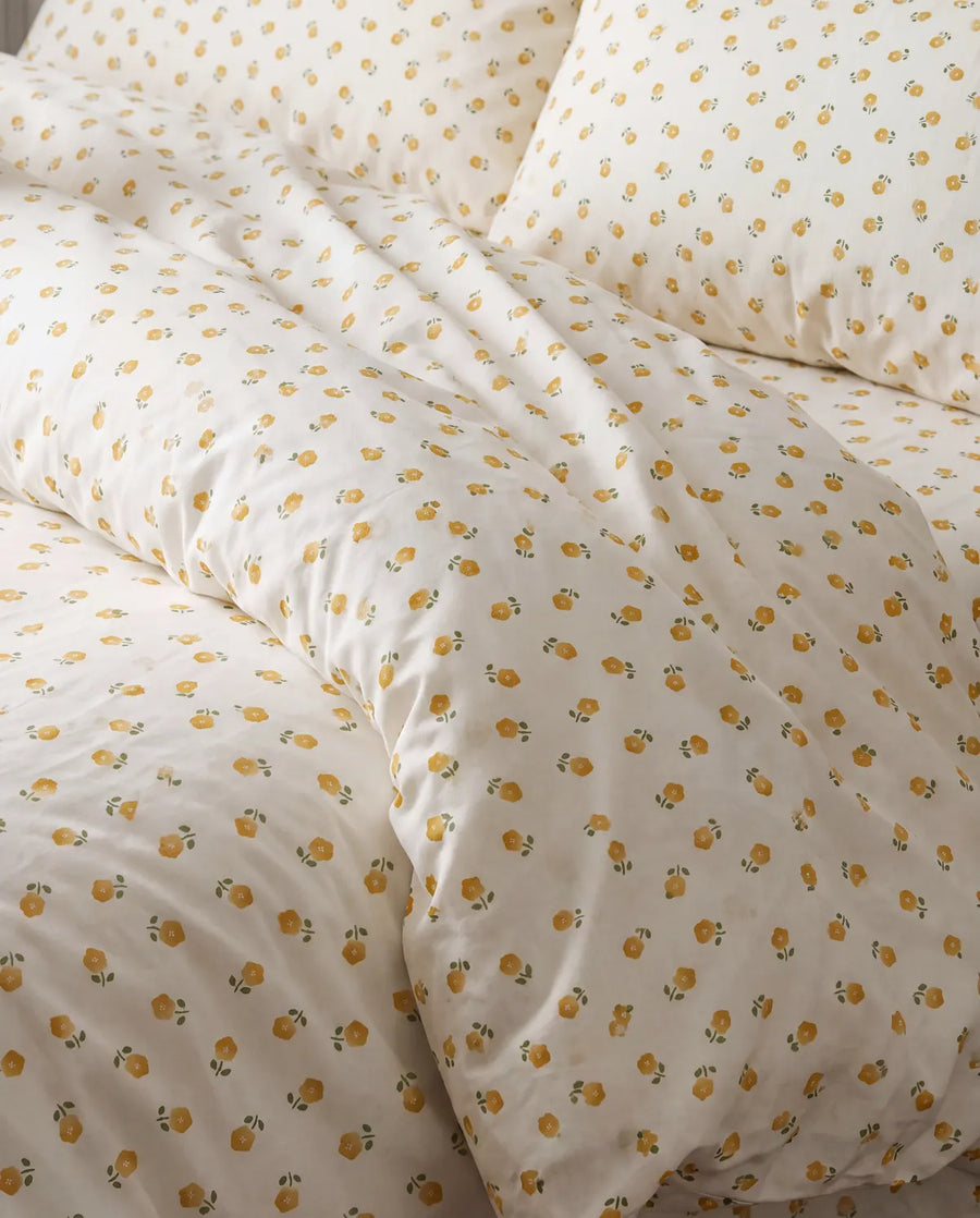 golden ditsy floral comforter set floral pattern closeup