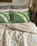 golden ditsy floral duvet cover set bedroom scene green ruffle pillows