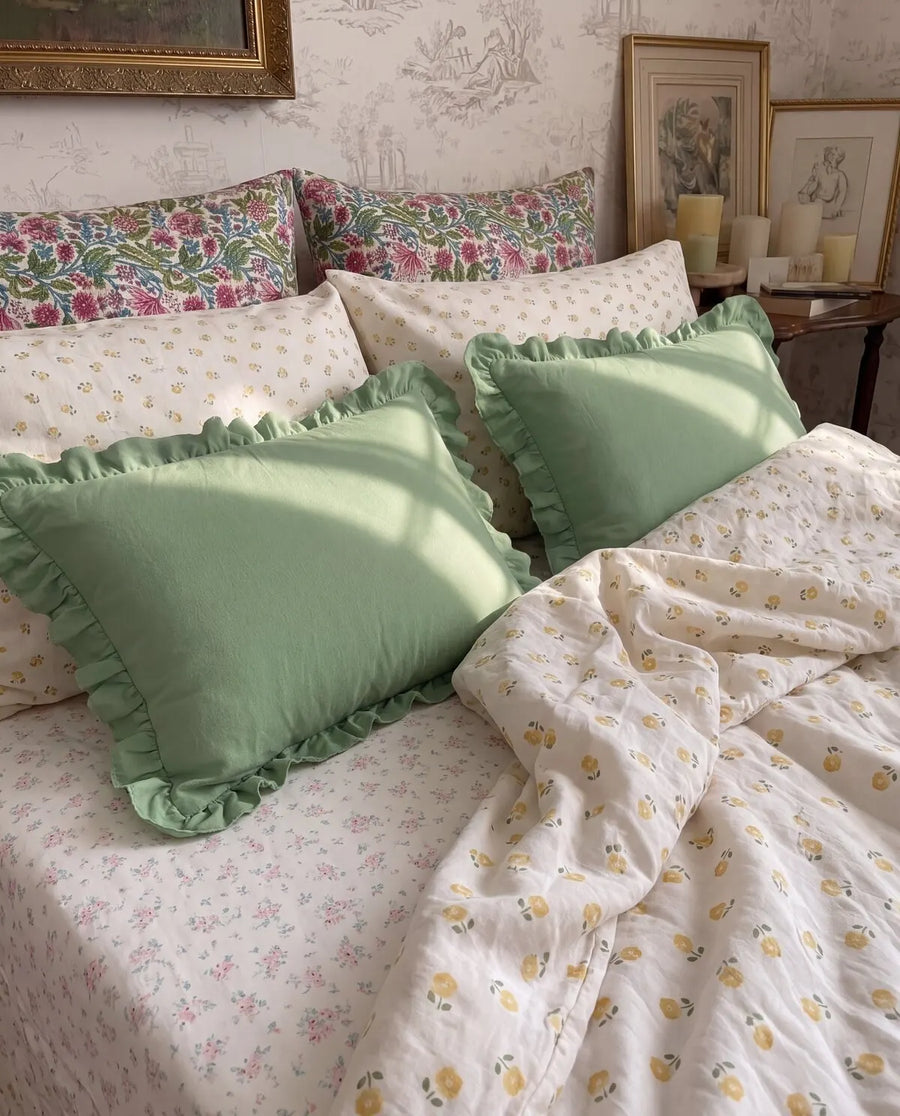 golden ditsy floral duvet cover set styled bed green ruffle shams