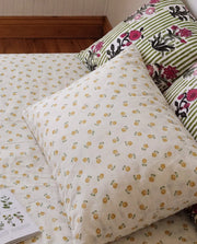 golden ditsy floral pillowcases botanical bedding styling