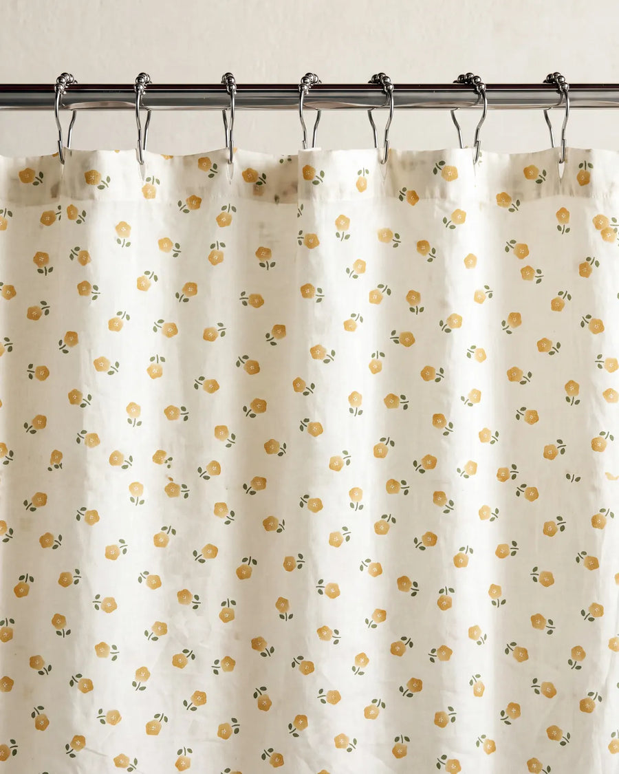 golden ditsy floral shower curtain hanging detail