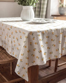 golden ditsy floral tablecloth draped corner detail