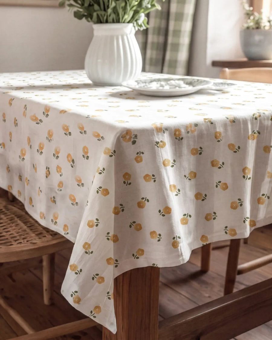 golden ditsy floral tablecloth draped corner detail