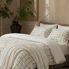 Angle view of green grid tufted bedding set