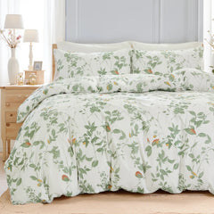 The  green leaf comforter set styled on a bed in a modern, cozy room.
