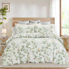 Full scene of the green leaf duvet cover set on a bed in a bright bedroom
