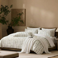 Lifestyle view of green plaid duvet cover on bed